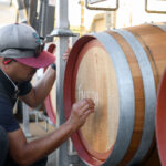 man with wine barrel